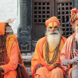 Spiritual Side of Nepal: three men wearing orange tradition clothes