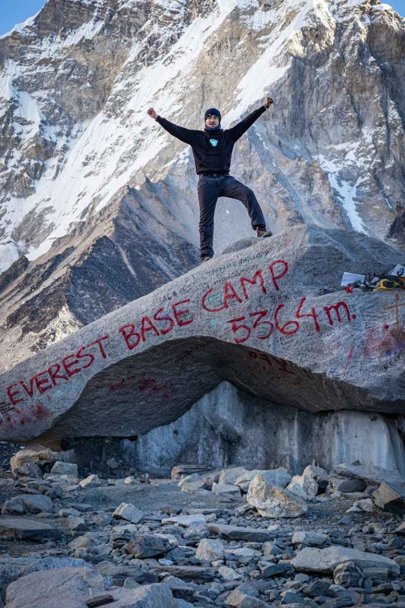 a man standing on gray rock