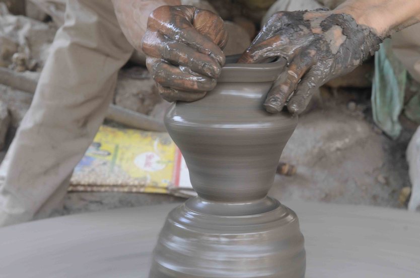 Traditional Pottery Art: A Must-do Experience in Bhaktapur 2 Local Potter moulding clay into earthen pot.